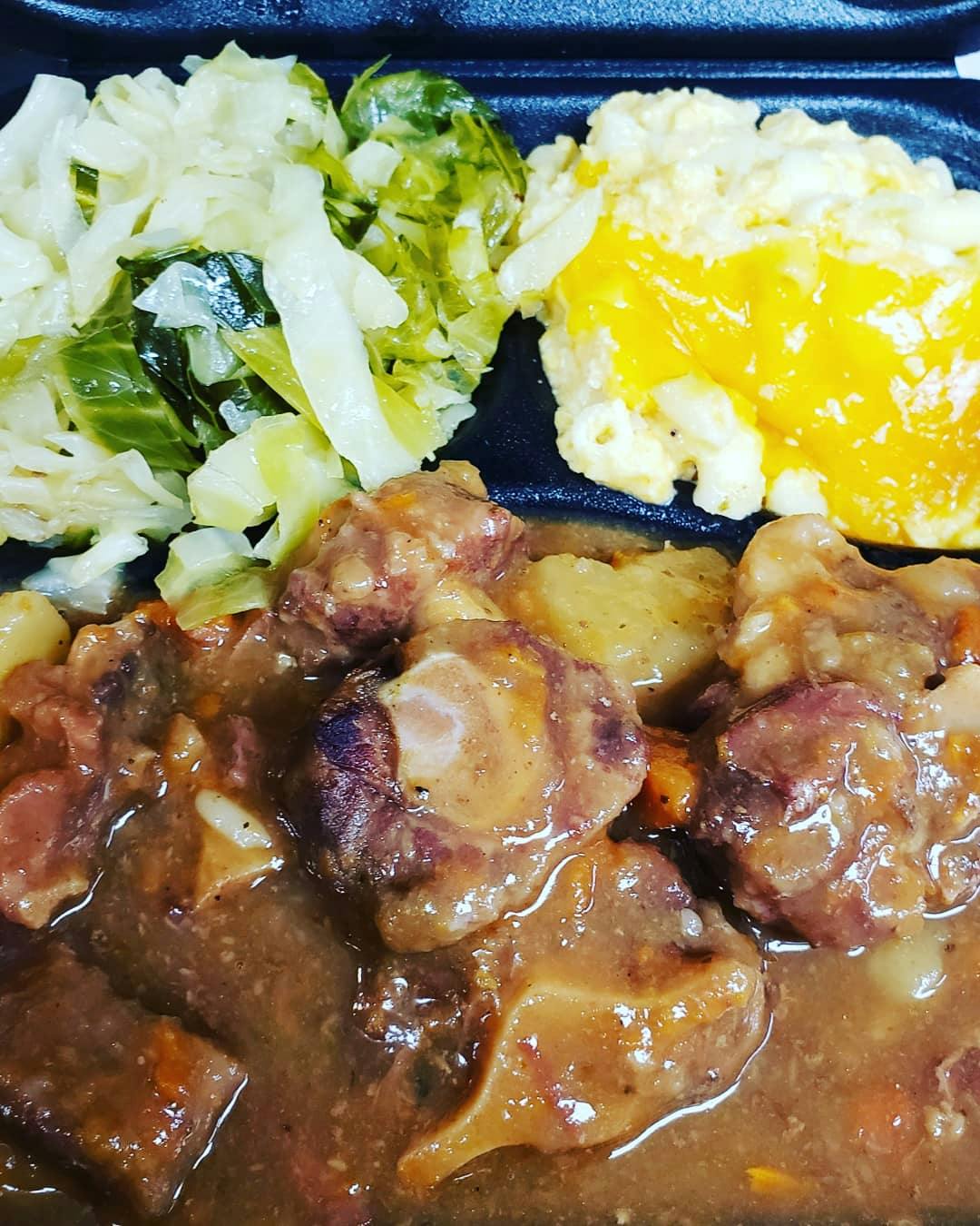 a close up of a plate topped with meat and vegetables